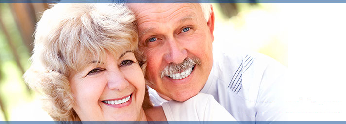 Image of two smiling retirees