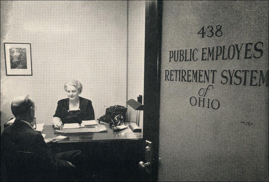 Two people sit across from each other at a desk in an office labeled "Public Employees Retirement System of Ohio.